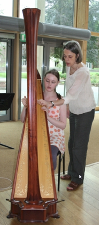 Ruth Faber teaching a harpist